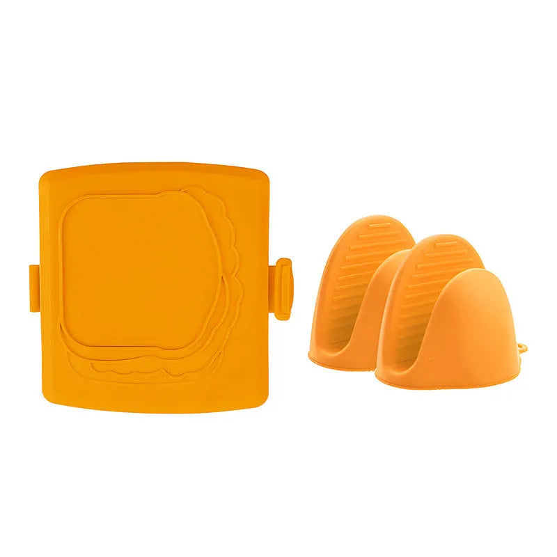 Red silicone baking tray with matching heat-resistant gloves on kitchen counter