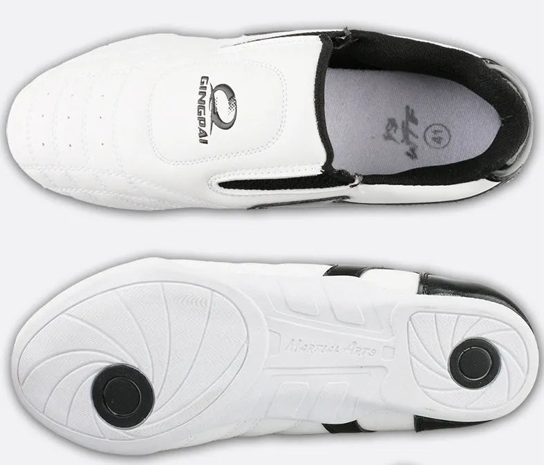 Black and white children's boxing shoes with soft bottom construction for martial arts training