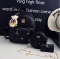 Women's three-piece backpack set with floral design including backpack, shoulder bag, and card holder