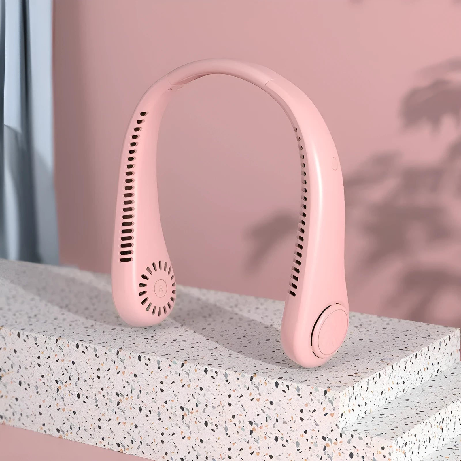 Pink USB rechargeable bladeless neck fan with adjustable speed settings