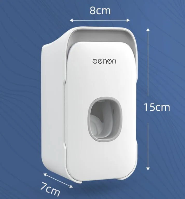 Blue automatic toothpaste dispenser with infrared sensor mounted on a bathroom wall.