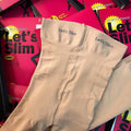 Beige and black lifting hips and abdomen stovepipe socks made from polyester fibre.