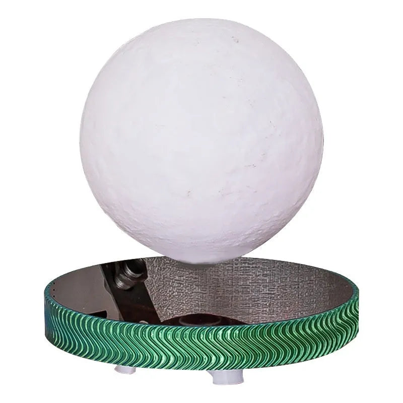 Magnetic suspension moon lamp floating above surface with USB cable