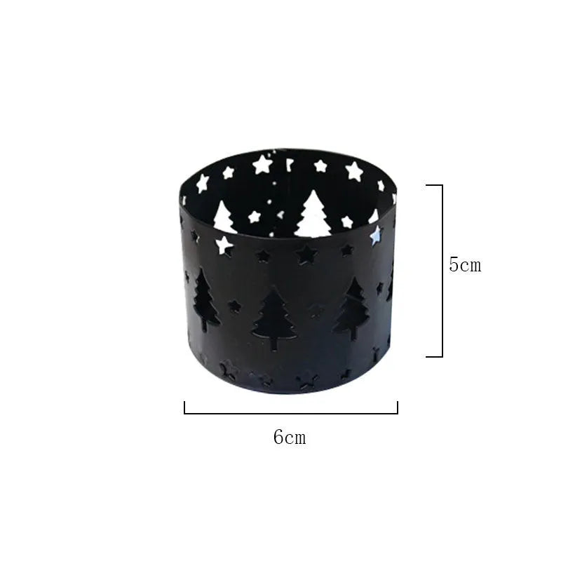 Black iron Christmas candlestick holder with decorative elk antler design.