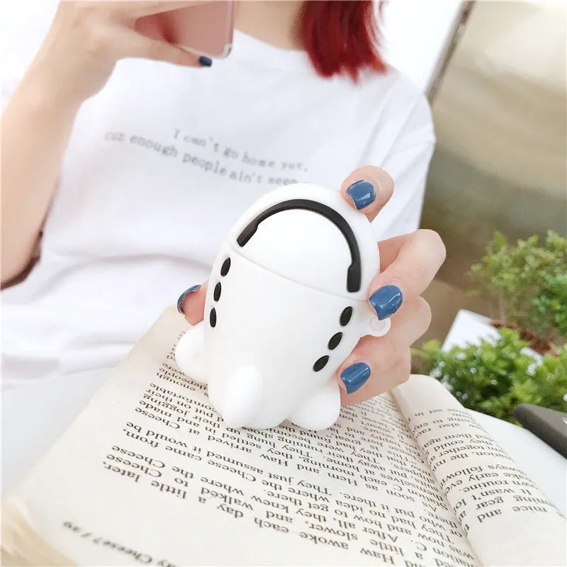 Silicone AirPods protective case with flip-top design, cartoon airplane graphics, and integrated carrying hook