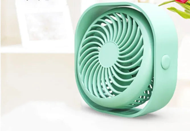 USB desk fan in blue colour with 360-degree rotation head and rotary switch, showing modern simple design.