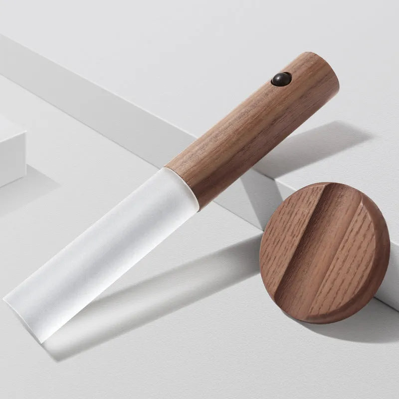Smart sensor LED desk lamp with solid wood base and clear acrylic shade on a wooden table.