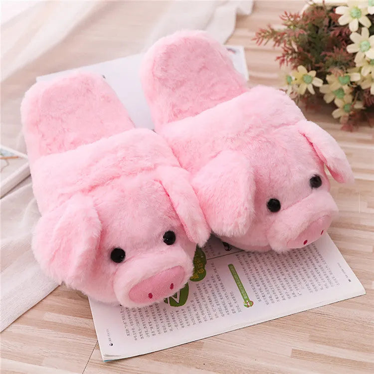 Pink plush pig slippers for adults with soft short fur and PP cotton filling on a white background.