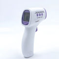 White digital non-contact thermometer with electronic display for temperature measurement