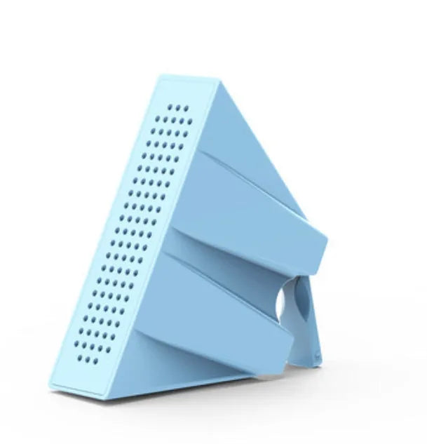 A small, coloured ABS plastic phone amplifier holder on a desktop, holding a mobile phone horizontally.