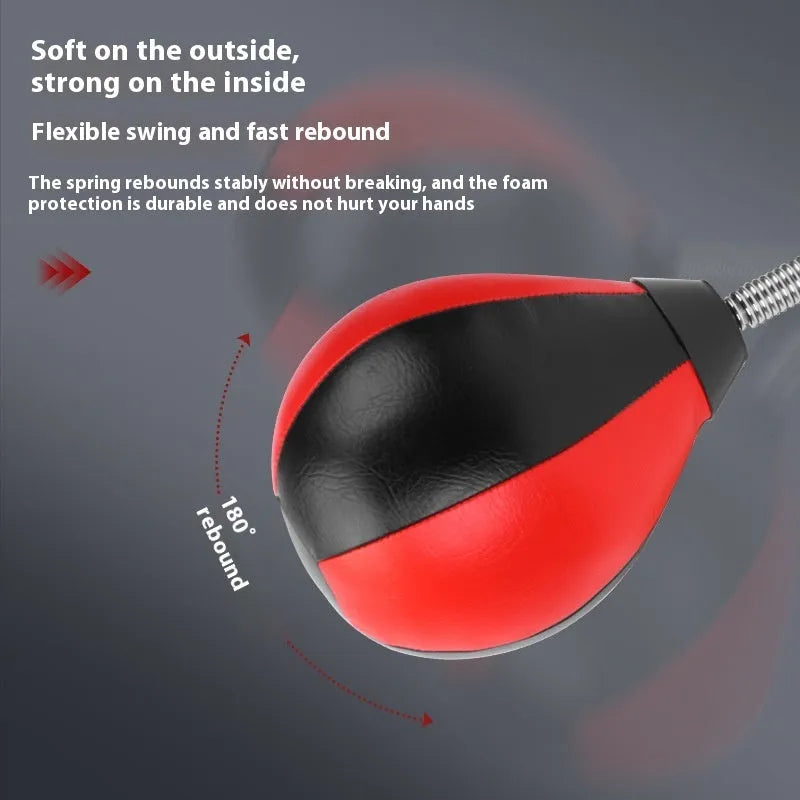 Pear-shaped black PU boxing reaction ball mounted on a wall with double suction cups for home training.