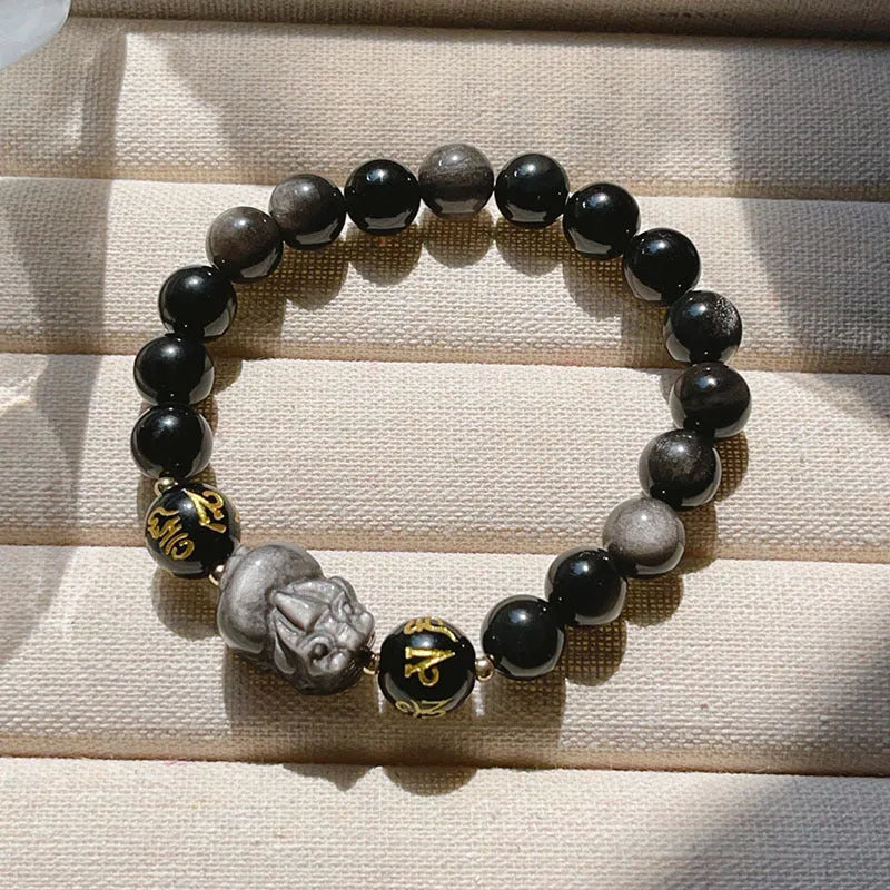 Men's silver stone bracelet with engraved zodiac and proverb designs on beaded surface