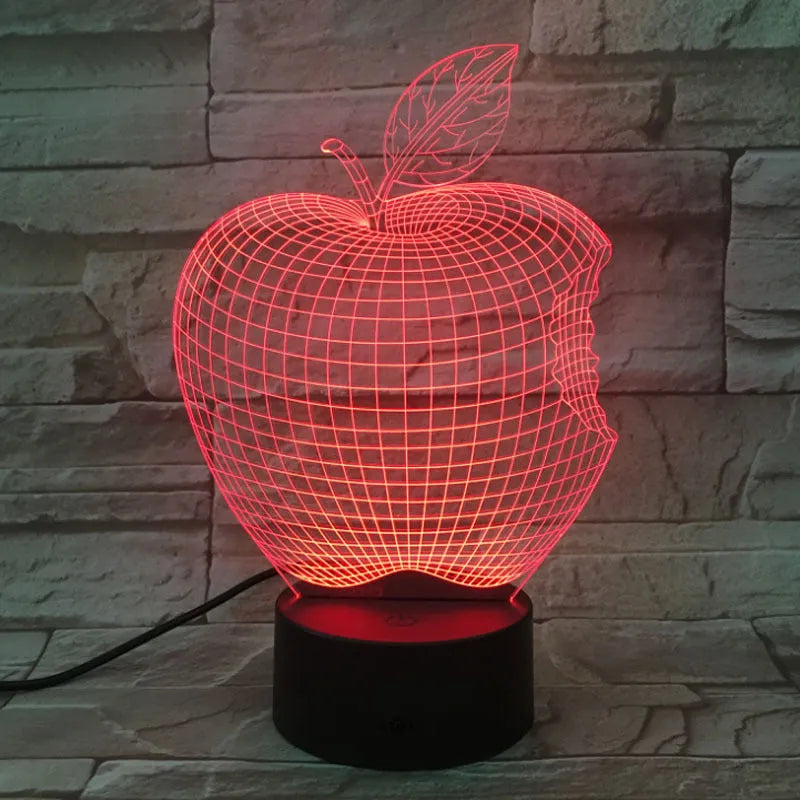 3D fruit-shaped night light with colourful LED glow on a tabletop.