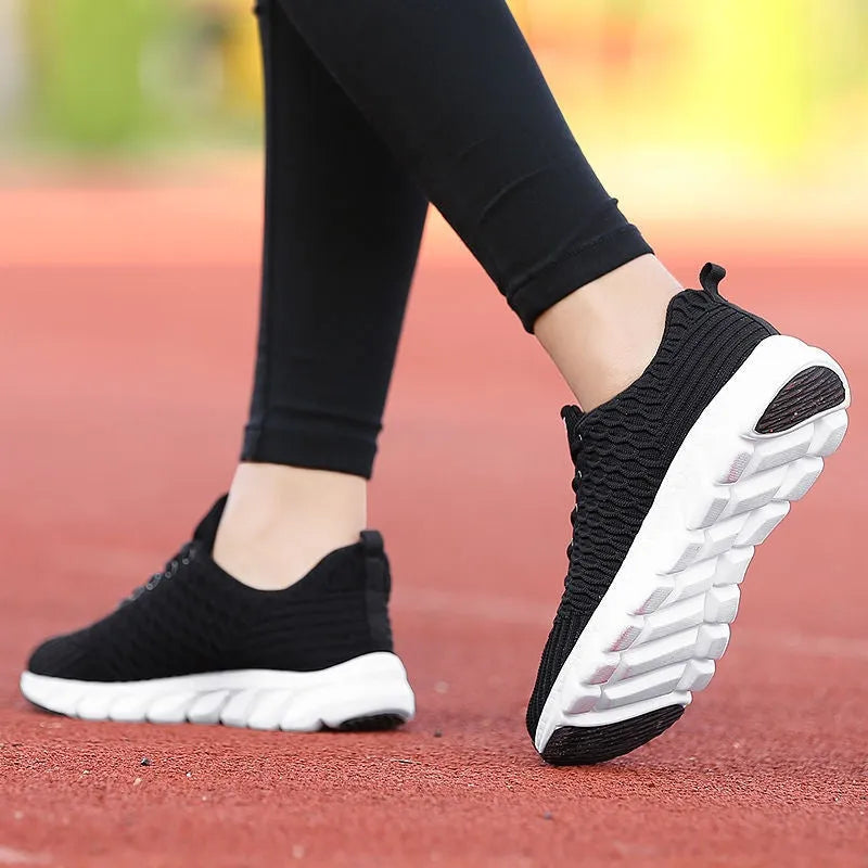 Women's running shoes with fly weaving upper in black, pink, or white colours.