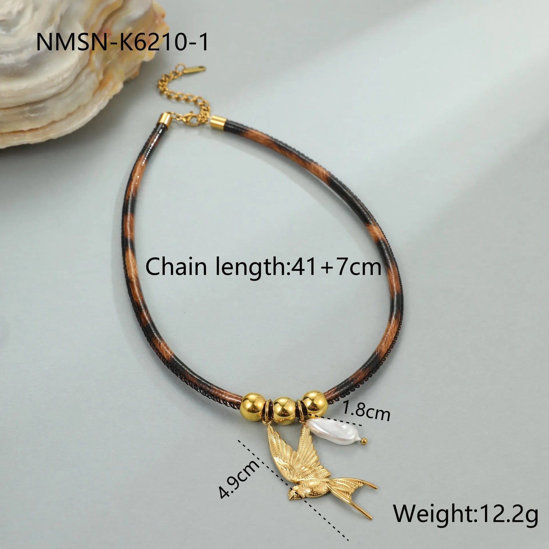 Geometric leopard print pendant on a stainless steel necklace chain with gold electroplated finish.