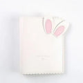 Rabbit style mini photo album in pink, blue, or white showing 3-inch photo slots