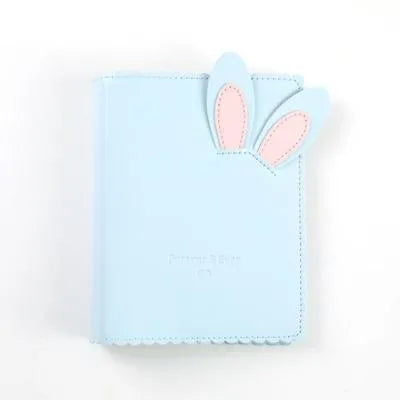 Rabbit style mini photo album in pink, blue, or white showing 3-inch photo slots