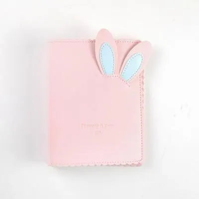 Rabbit style mini photo album in pink, blue, or white showing 3-inch photo slots
