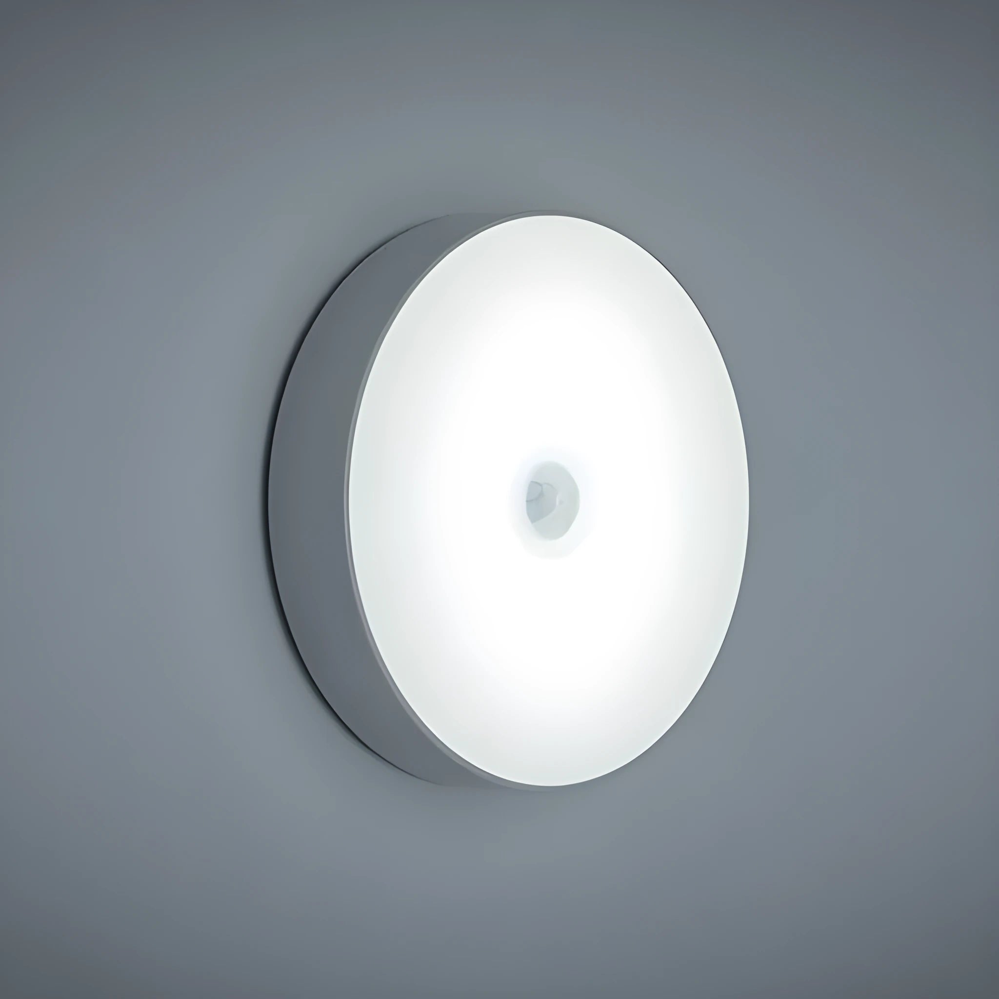 USB rechargeable body sensing LED night light in beige or white with 86mm diameter