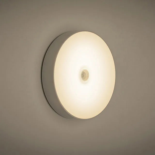 USB rechargeable body sensing LED night light in beige or white with 86mm diameter