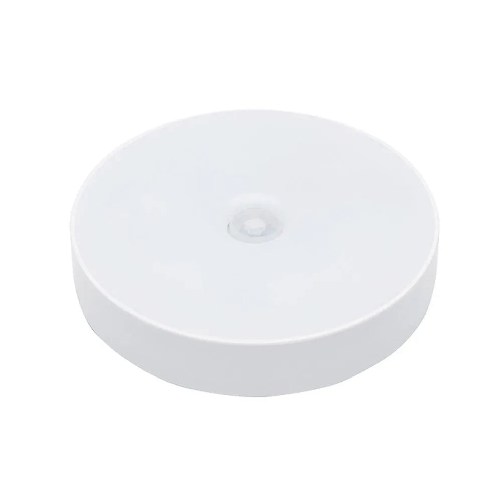USB rechargeable body sensing LED night light in beige or white with 86mm diameter
