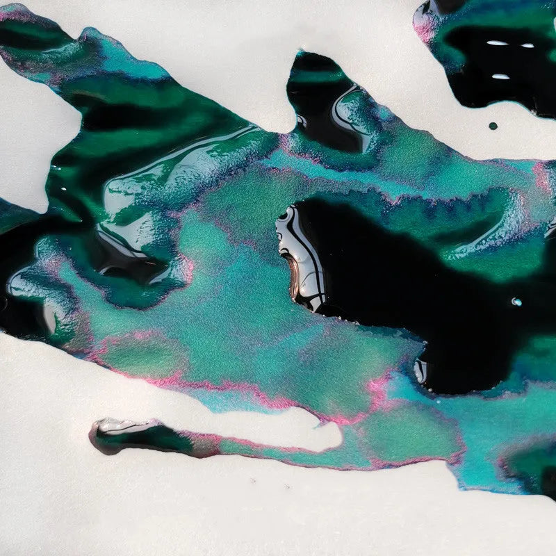 Bottle of gradient ink with gold powder particles for fountain pens and dip pens in Red Tide or Truffle colour.
