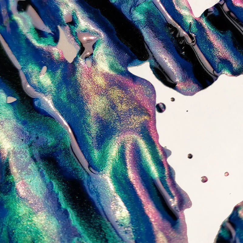 Bottle of gradient ink with gold powder particles for fountain pens and dip pens in Red Tide or Truffle colour.