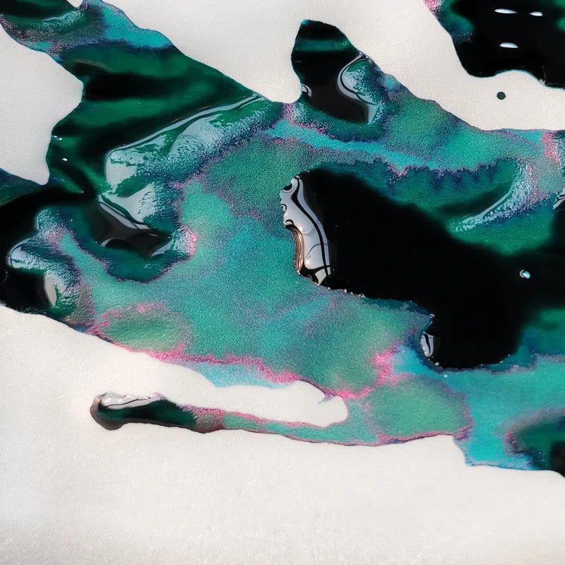 Bottle of gradient ink with gold powder particles for fountain pens and dip pens in Red Tide or Truffle colour.