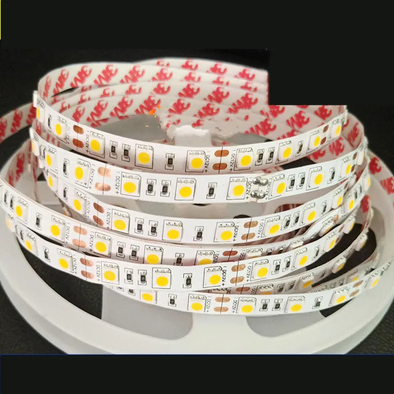 Rectangular patch-style 12V LED light strip mounted under a supermarket shelf for white accent lighting.