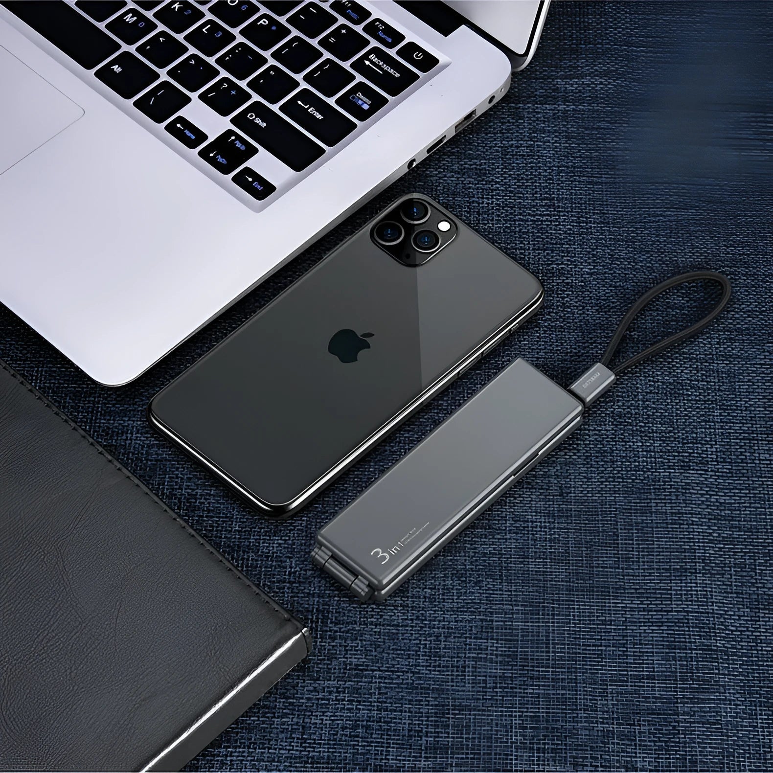 Black portable USB charger with three ports for iPhone, Type-C, and Micro cables on a short 0.2m cord.