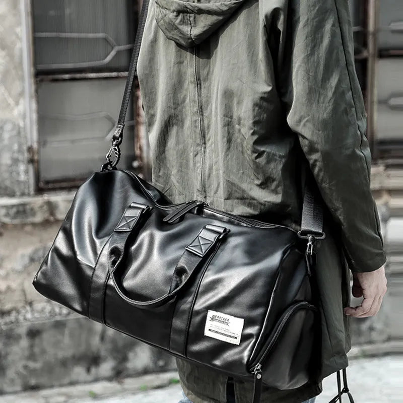 Large black waterproof PU leather sports bag with multiple zipper pockets and a single shoulder strap.
