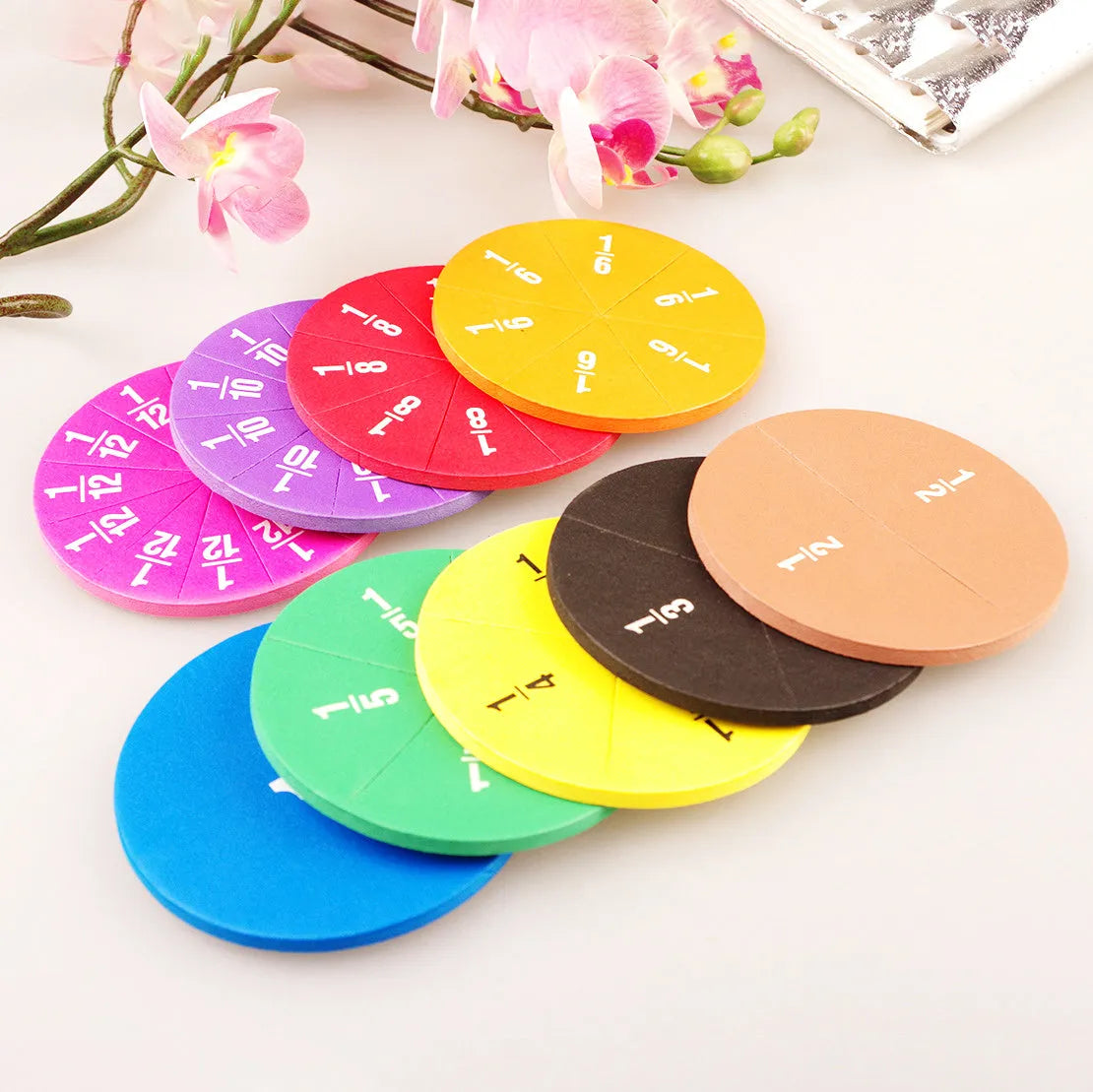 Fraction teaching aids set with magnetic blocks, transparent rulers, and activity corners on a desk.