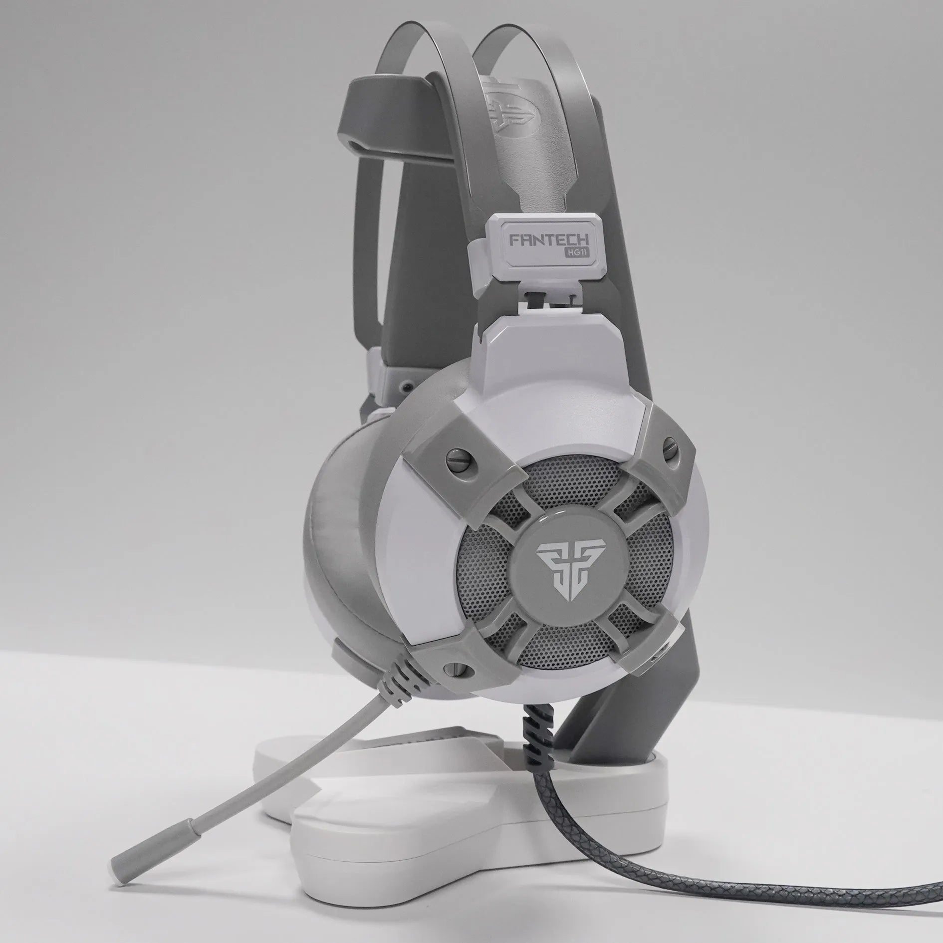 Black FANTECH HG11 USB gaming headset with RGB lights on the earcups and a 2.1m cable with inline remote.