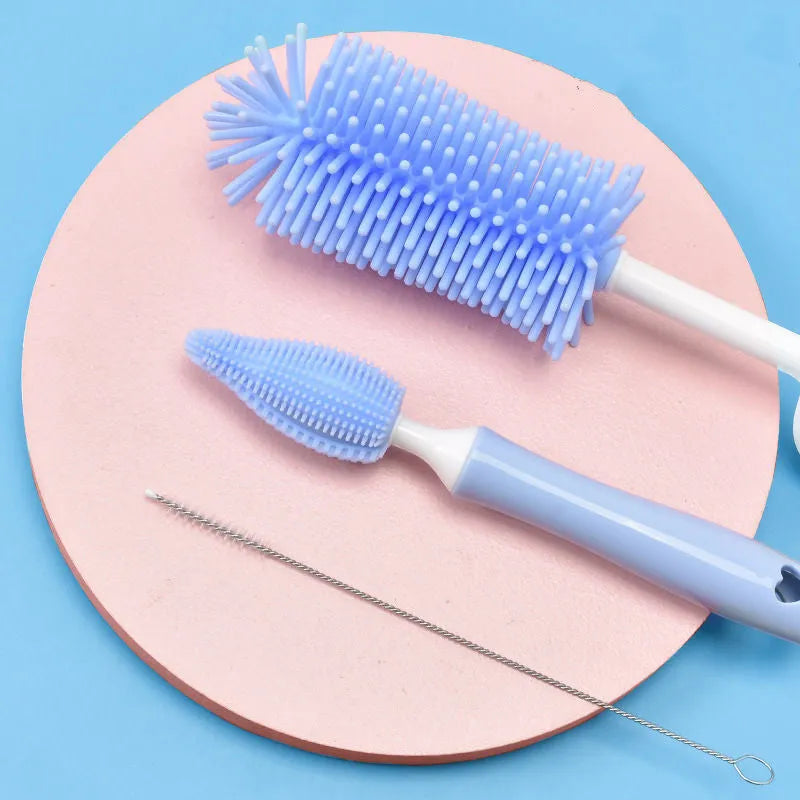 Silicone baby bottle brush set with straw cleaning brush in pink, blue, and yellow colours