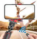 Black aluminium video stabilizer tripod with phone clamp extended, showing five-section links and integrated self timer button.