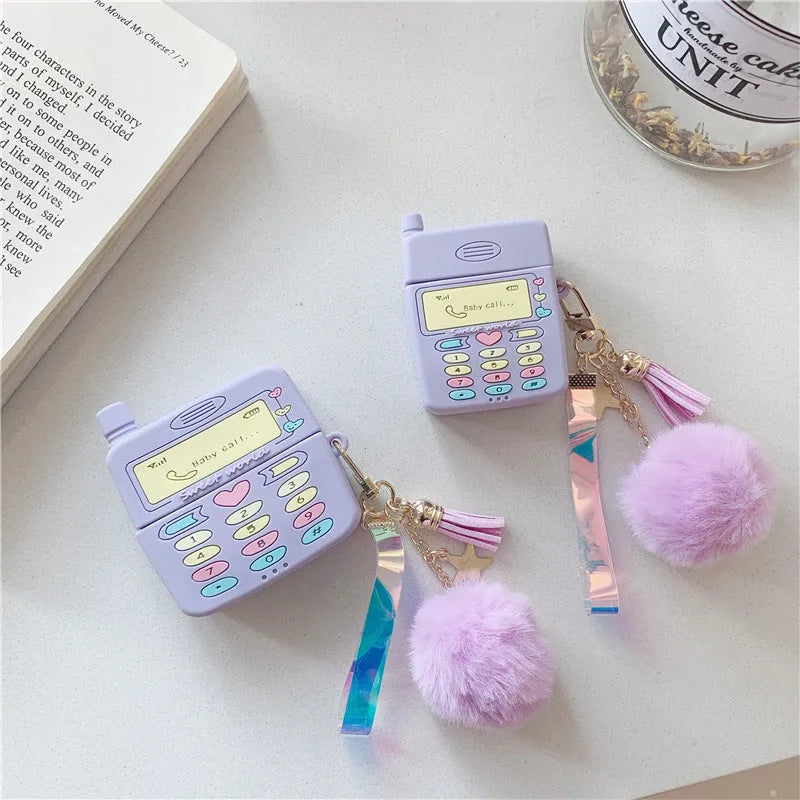 Purple silicone protective case with a fur ball pendant for Apple AirPods Pro and AirPods 1 and 2.