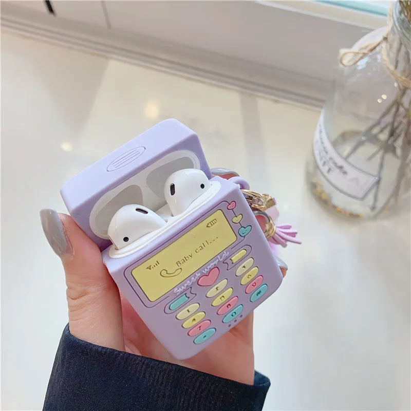 Purple silicone protective case with a fur ball pendant for Apple AirPods Pro and AirPods 1 and 2.