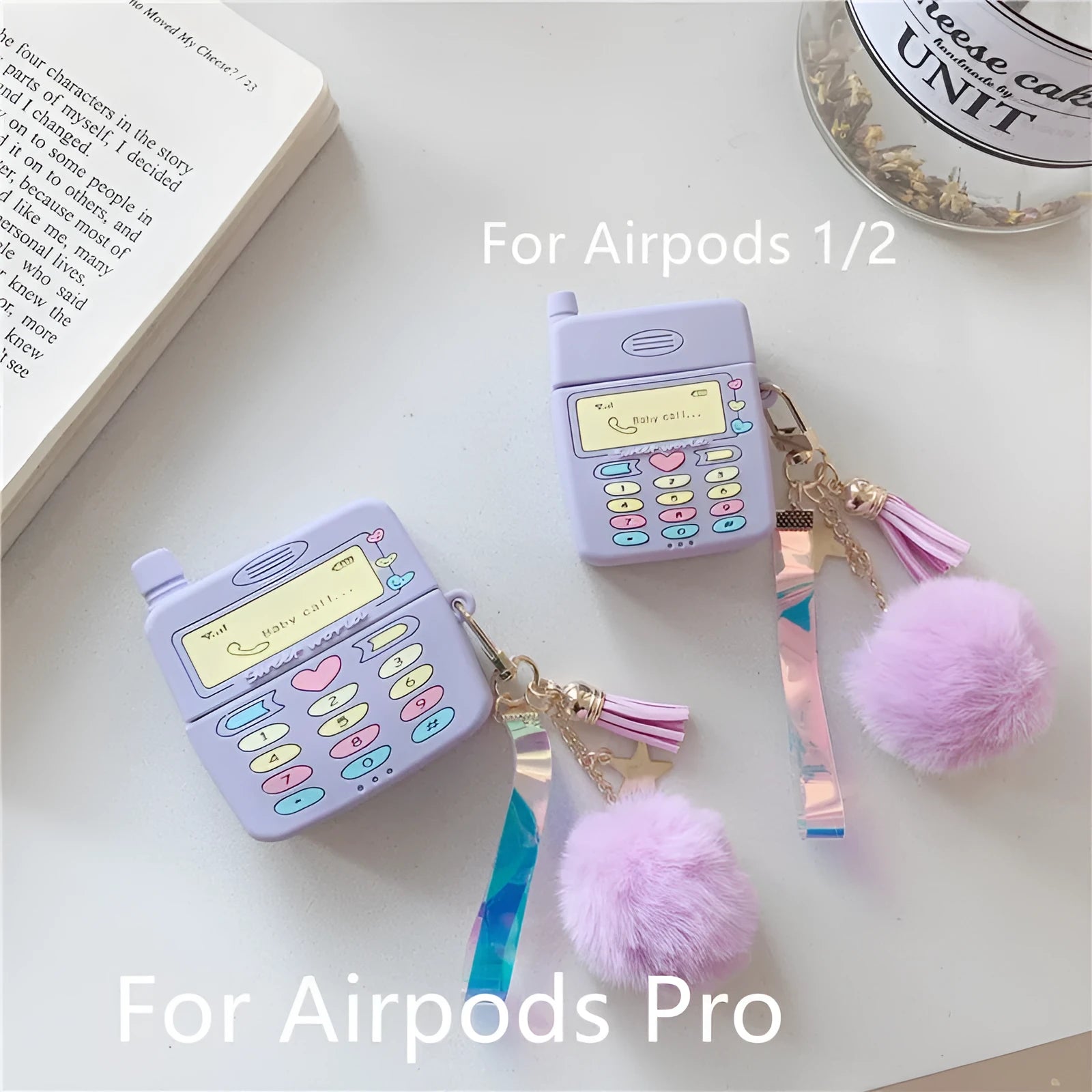 Purple silicone protective case with a fur ball pendant for Apple AirPods Pro and AirPods 1 and 2.