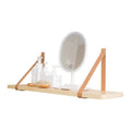 Nordic style pine wood wall shelf measuring 50cm wide, holding remote controls and books