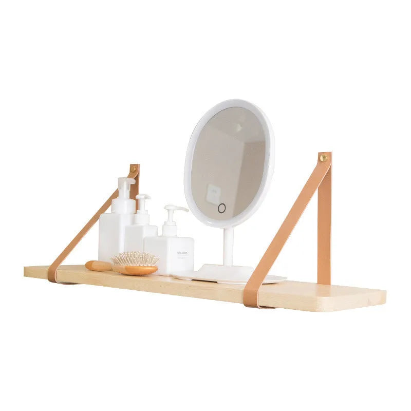 Nordic style pine wood wall shelf measuring 50cm wide, holding remote controls and books