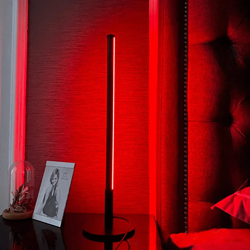 Nordic minimalist black bedside lamp with remote control on wooden nightstand