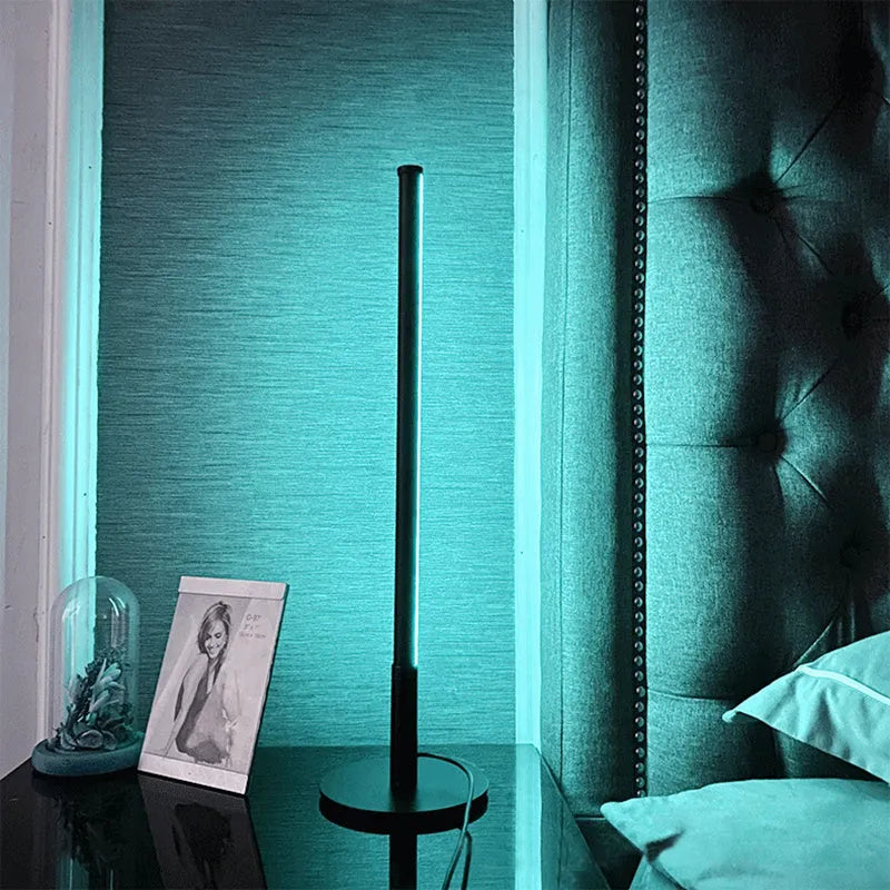 Nordic minimalist black bedside lamp with remote control on wooden nightstand