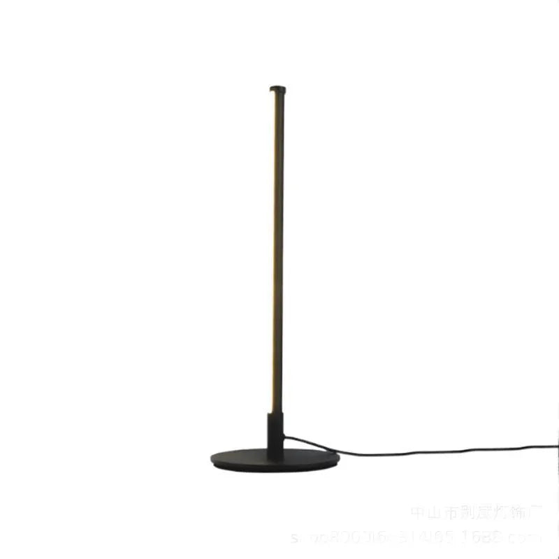 Nordic minimalist black bedside lamp with remote control on wooden nightstand