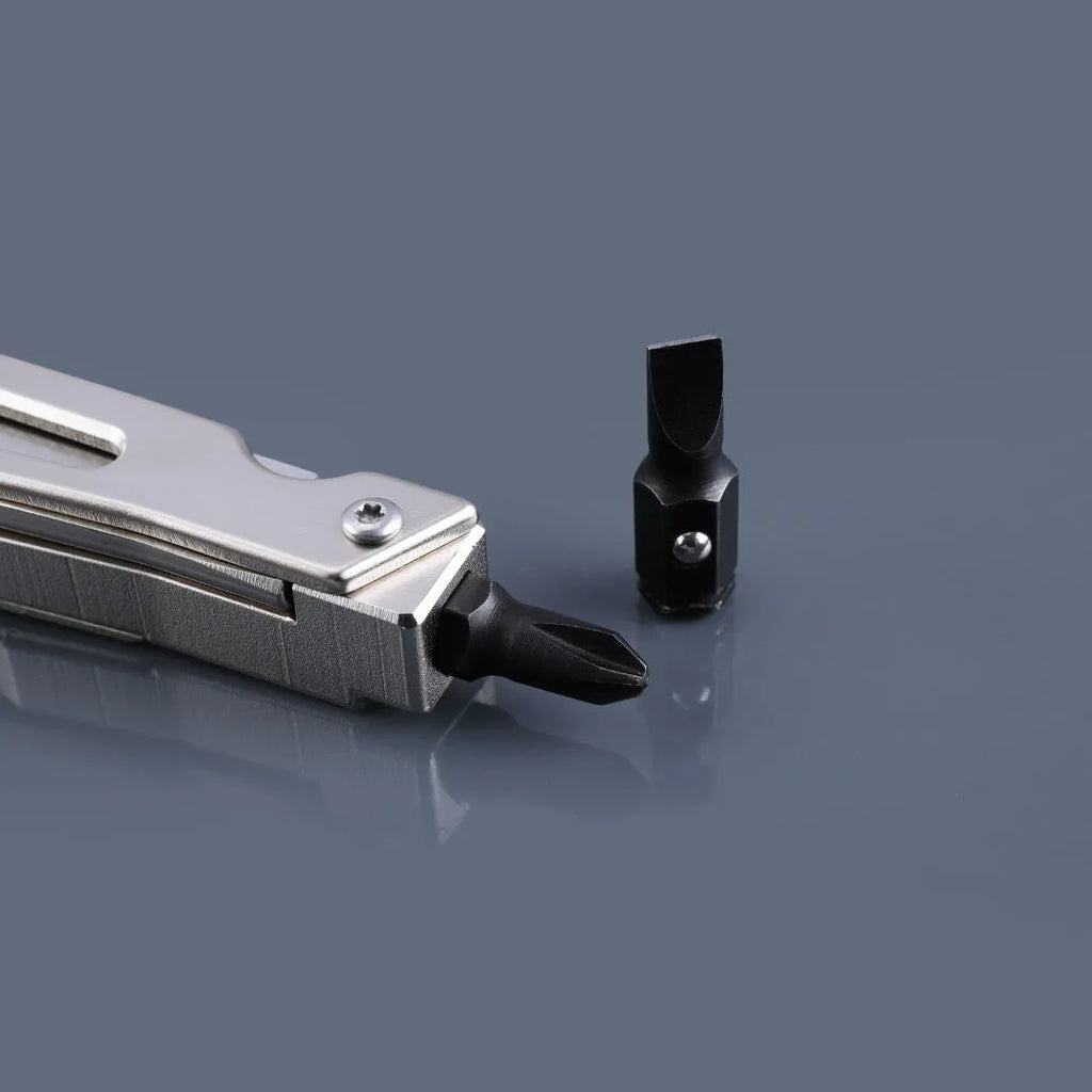 White stainless steel multi-function tool showing wrench, knife blade, and needle nose pliers