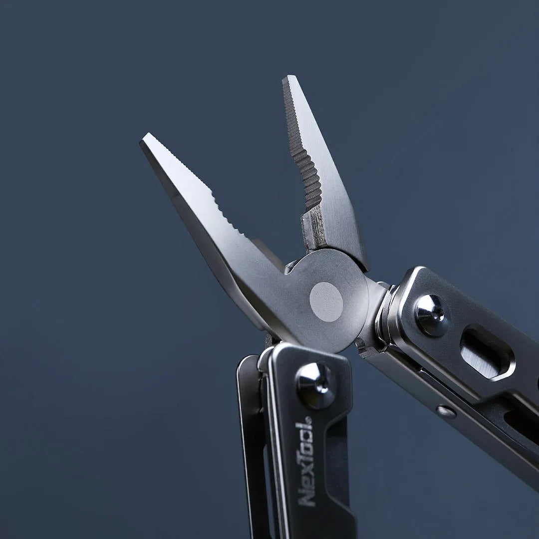 White stainless steel multi-function tool showing wrench, knife blade, and needle nose pliers