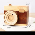 Wooden camera-themed music box with rotating mechanism on pine wood base
