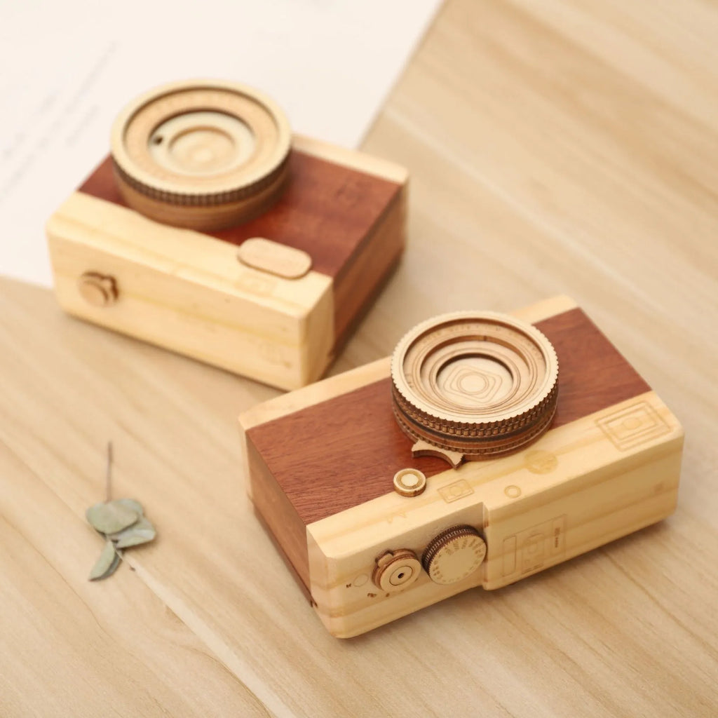 Wooden camera-themed music box with rotating mechanism on pine wood base