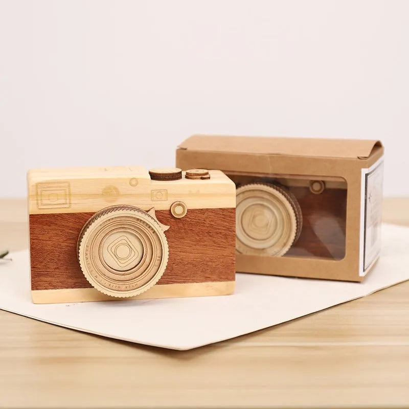 Wooden camera-themed music box with rotating mechanism on pine wood base