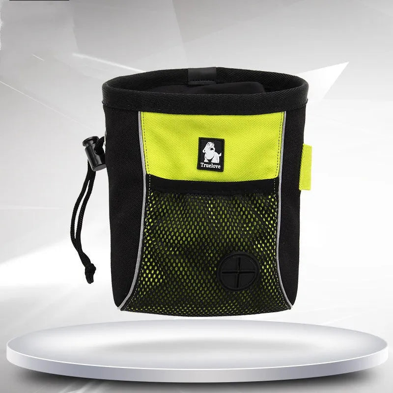 Green waterproof dog training waist bag with a removable waste bag compartment, shown on a person's waist.