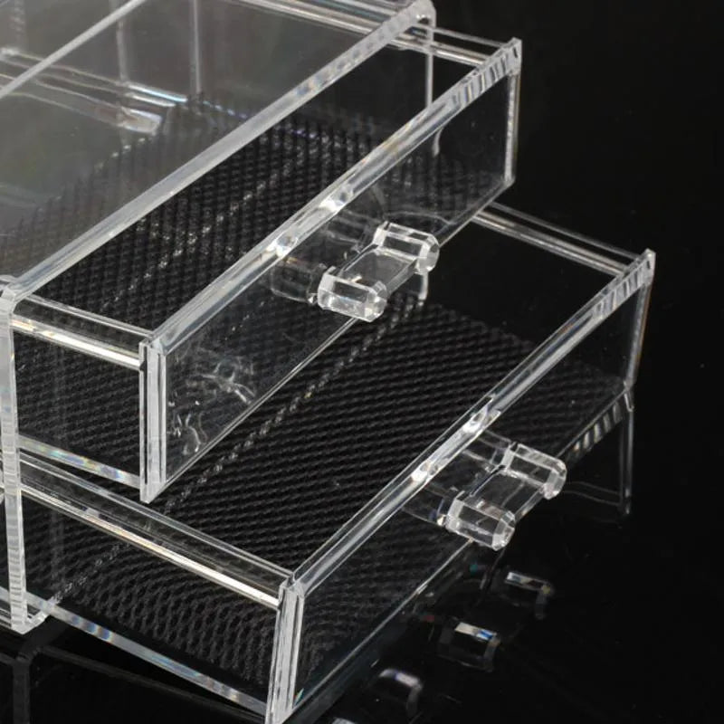 Clear acrylic makeup storage case with transparent sides showing cosmetic organisation